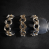 3 BiMetal Triple Orbital Bracelets on a black background