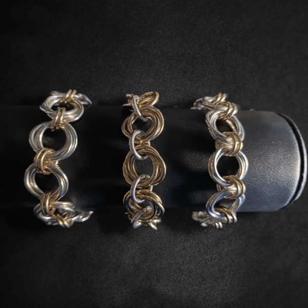3 BiMetal Triple Orbital Bracelets on a black background